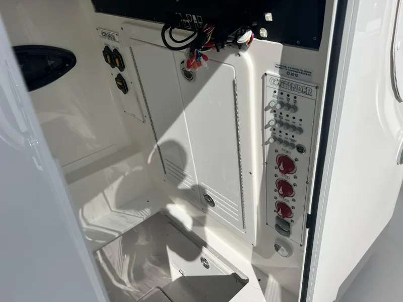 Slide: The Image of Contender 30 ST 2025 boat interior with control panel and wiring. - 16