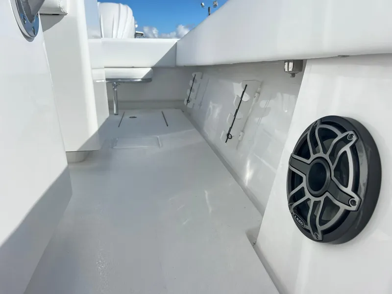 Slide: The Image of 2025 Contender 30 ST boat interior with speaker and clean deck design. - 19
