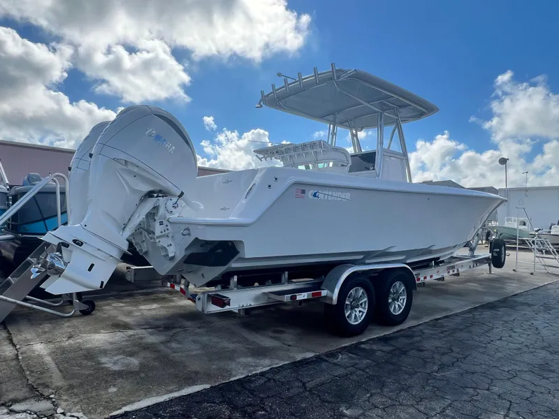 Slide: The Image of 2025 Contender 30 ST boat on trailer under cloudy sky. - 3
