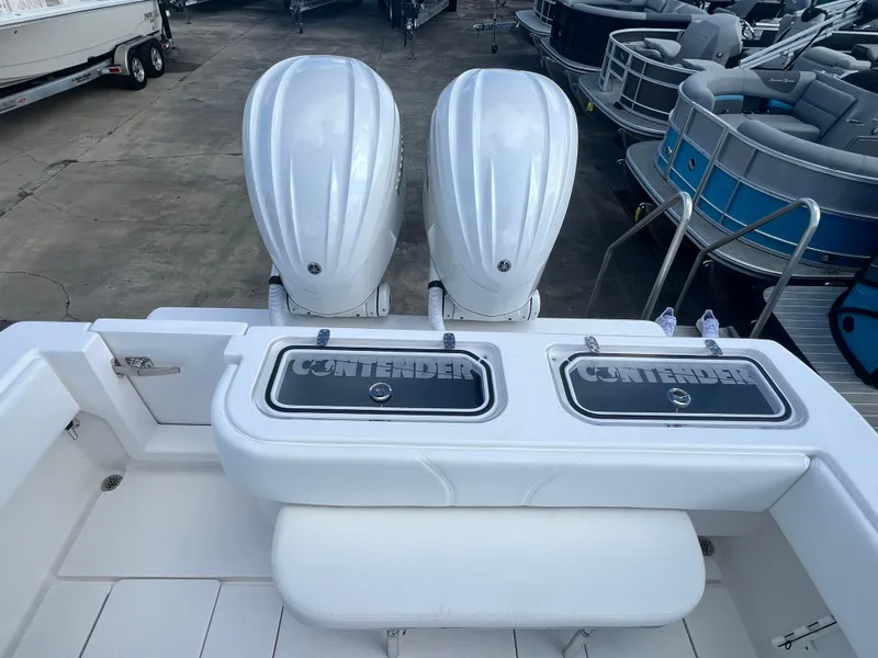 Slide: The Image of 2025 Contender 30 ST boat with dual outboard engines and spacious deck layout. - 5