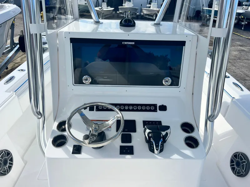 Slide: The Image of 2025 Contender 30 ST boat console with steering wheel and controls. - 8