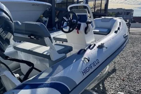 Slide: The Image of 2025 Highfield Classic 380 GT boat on trailer, displayed outdoors. - 2