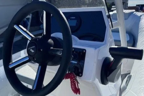 Slide: The Image of Highfield Classic 380 GT 2025 boat detail with control panel and branding. - 9