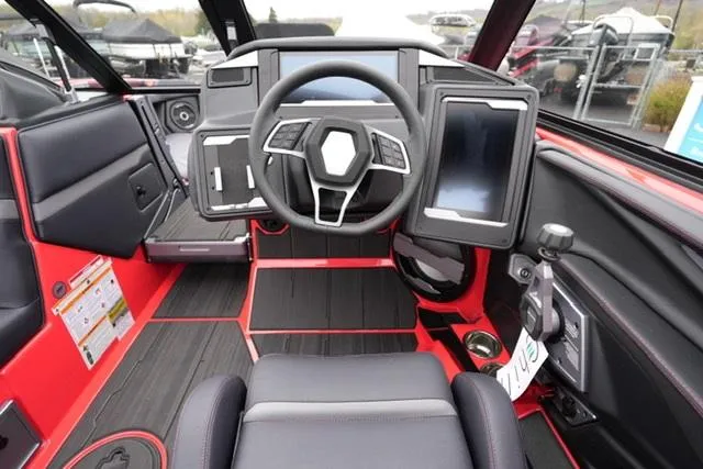 Slide: The Image of 2025 Supra SA 450 boat cockpit with modern steering and digital controls. - 10