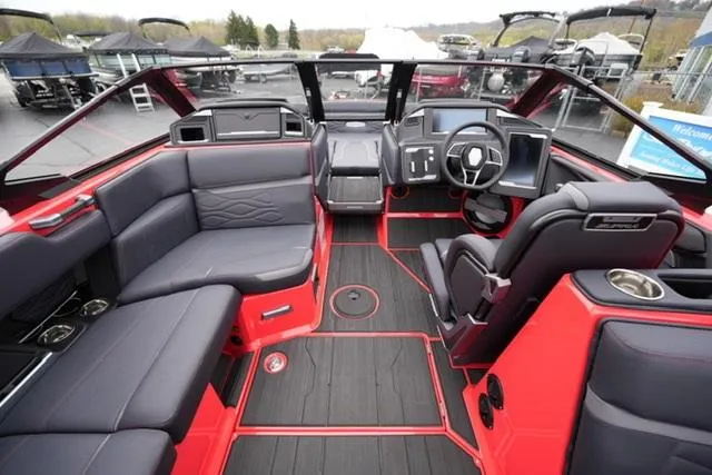 Slide: The Image of Luxurious 2025 Supra SA 450 boat interior with sleek black and red design. - 11
