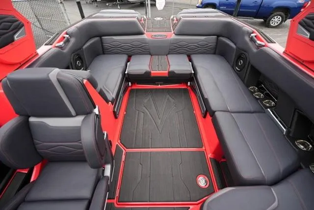 Slide: The Image of 2025 Supra SA 450 boat interior with red and black seating and flooring. - 14