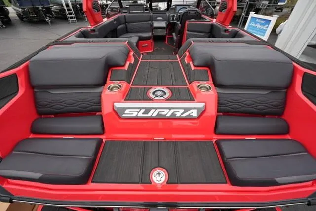 Slide: The Image of 2025 Supra SA 450 boat interior with red and black seating, luxury design. - 15
