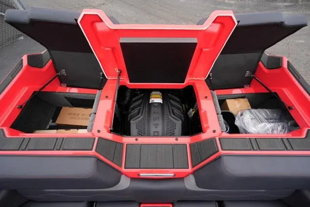 Slide: The Image of 2025 Supra SA 450 boat engine compartment with open hatches, showcasing storage and engine layout. - 16