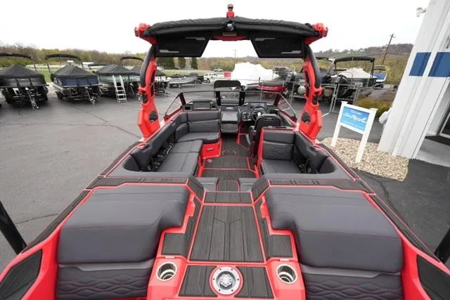 Slide: The Image of 2025 Supra SA 450 boat interior with red and black seating, sleek design. - 6