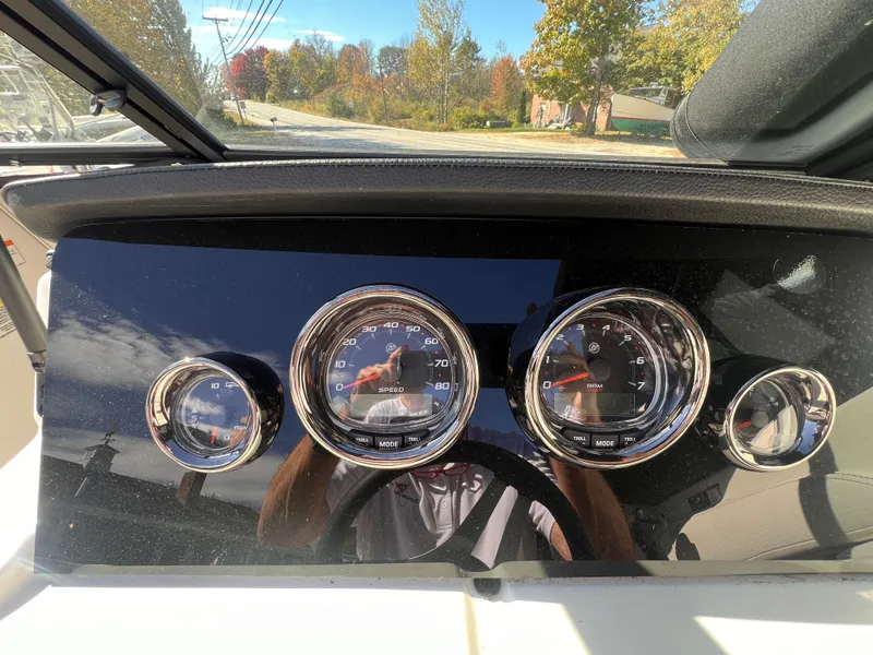 Slide: The Image of Dashboard of 2023 Sea Ray SPX 190 boat with gauges and reflections. - 16