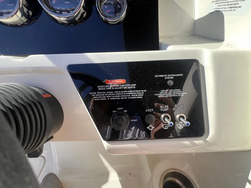 Slide: The Image of Control panel of 2023 Sea Ray SPX 190 boat with switches and gauges. - 17