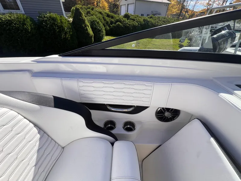 Slide: The Image of 2023 Sea Ray SPX 190 boat interior with white seating and modern design. - 20