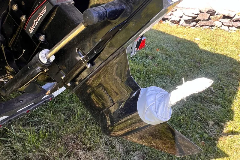 Slide: The Image of 2023 Sea Ray SPX 190 boat with MerCruiser engine, propeller covered, on grass. - 23