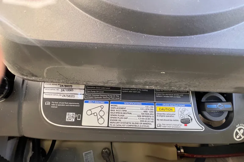 Slide: The Image of Close-up of a 2023 Sea Ray SPX 190 engine label with safety instructions. - 27