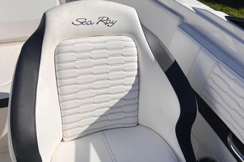 Slide: The Image of 2023 Sea Ray SPX 190 boat seat with elegant white and black design. - 8