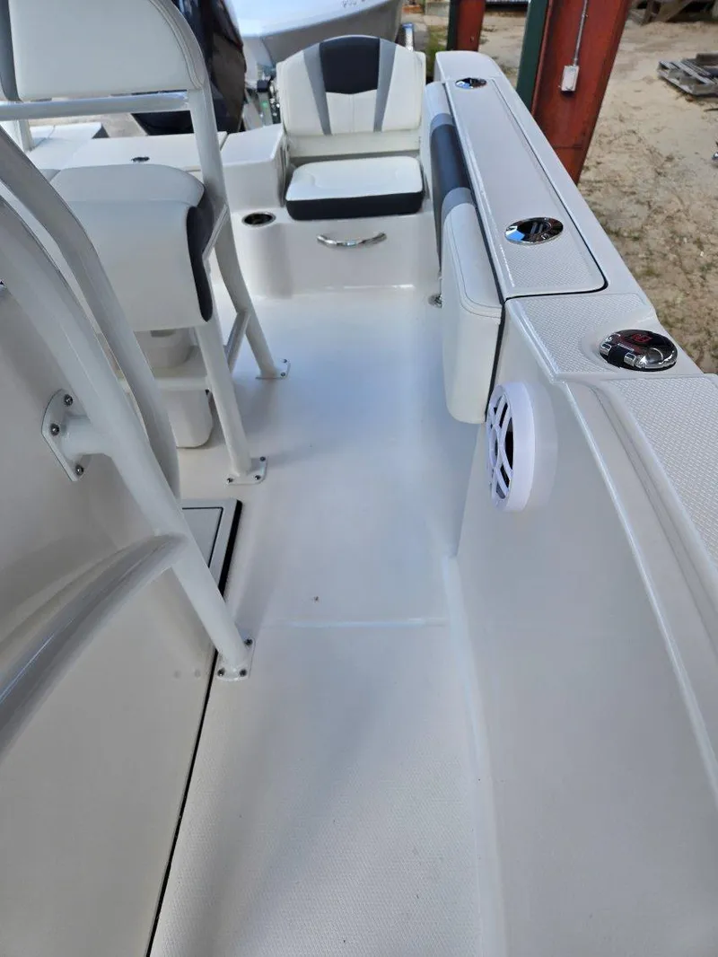 Slide: The Image of 2025 Robalo R180 Center Console boat interior with seating and storage compartments. - 26