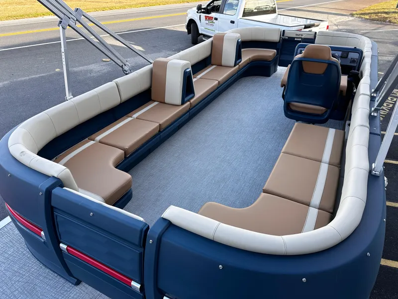 Slide: The Image of 2025 Avalon 2385 Aura Quad Lounge Twin Toon boat with spacious seating and modern design. - 9