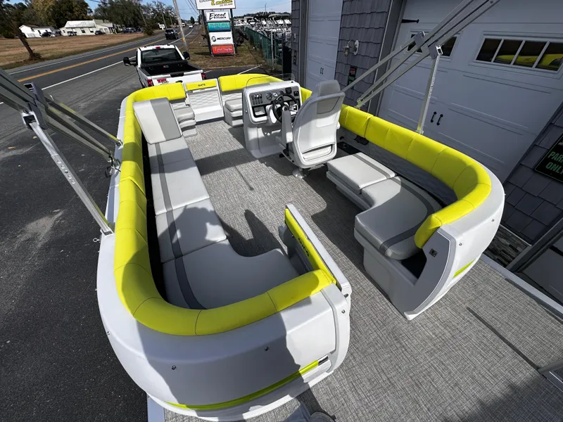 Slide: The Image of 2025 Avalon 2185 Aura Quad Lounge boat with spacious seating and modern design. - 12