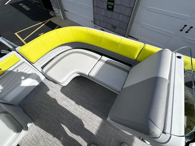 Slide: The Image of 2025 Avalon 2185 Aura Quad Lounge interior with modern seating and vibrant yellow accents. - 14