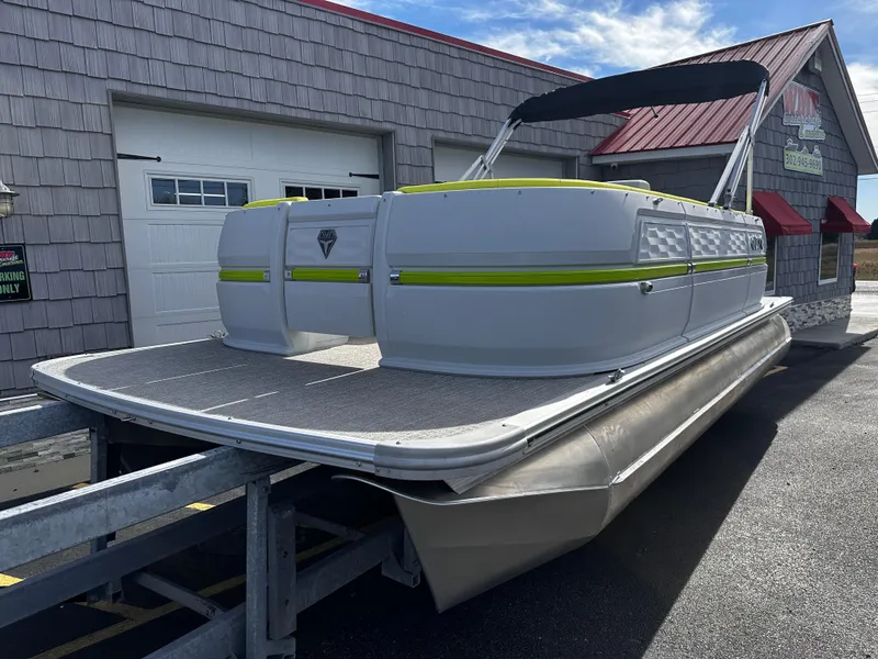 Slide: The Image of 2025 Avalon 2185 Aura Quad Lounge Twin Toon pontoon boat on trailer. - 3