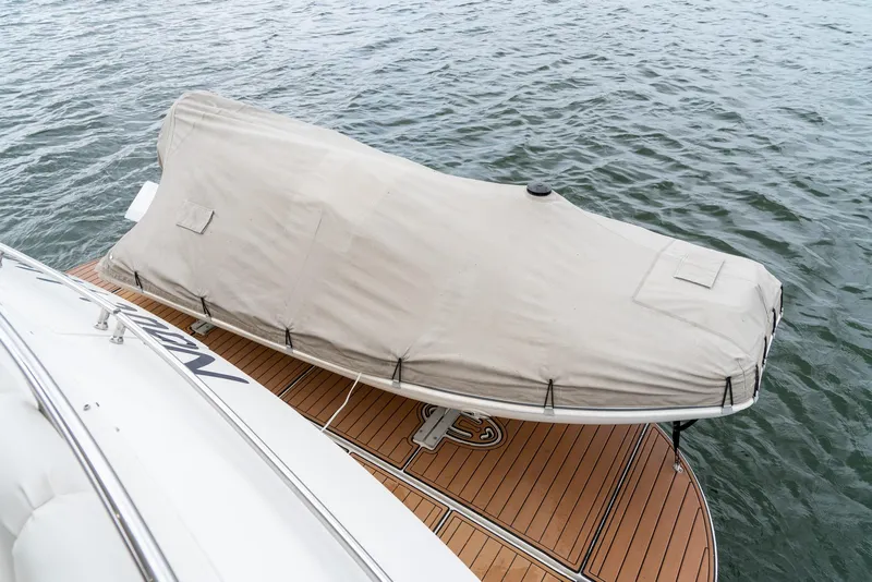 Slide: The Image of Covered boat on Marquis 59 Markham Edition yacht, 2007, docked on water. - 11