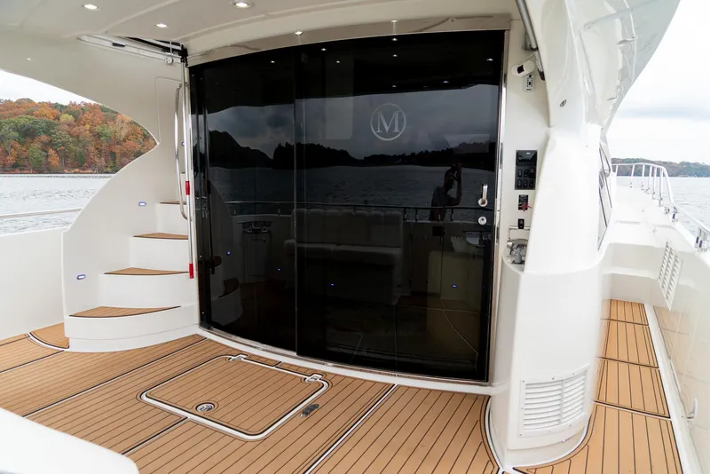 Slide: The Image of Luxury yacht deck of 2007 Marquis 59 Markham Edition with sleek design and wood flooring. - 15