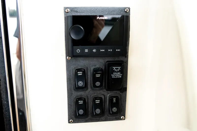 Slide: The Image of Control panel on 2007 Marquis 59 Markham Edition yacht with switches and display. - 21