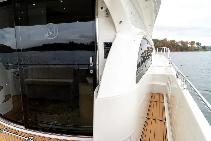 Slide: The Image of Luxury yacht Marquis 59 Markham Edition, 2007, with sleek design and scenic lake view. - 22