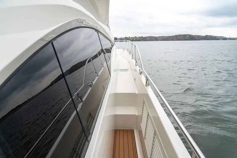 Slide: The Image of Side view of 2007 Marquis 59 Markham Edition yacht on calm water. - 23