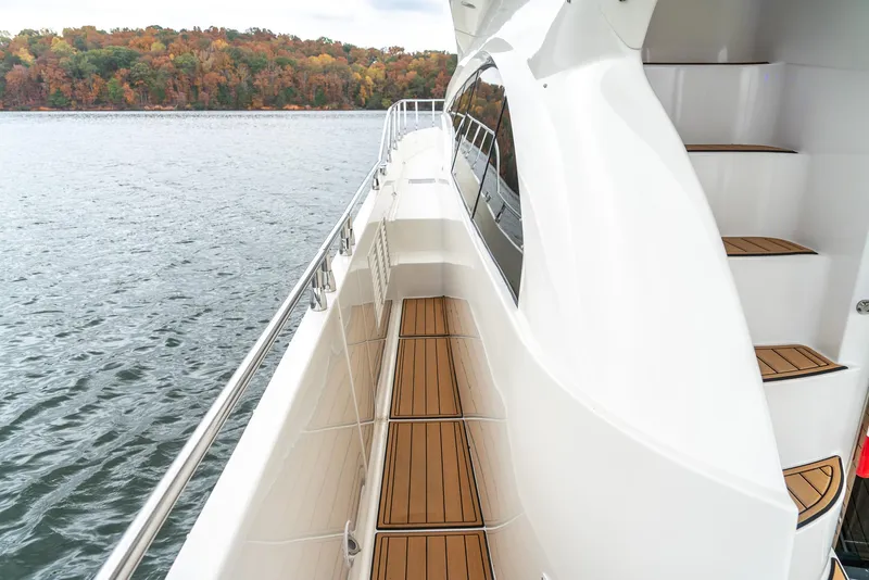 Slide: The Image of 2007 Marquis 59 Markham Edition yacht deck with scenic water view. - 24