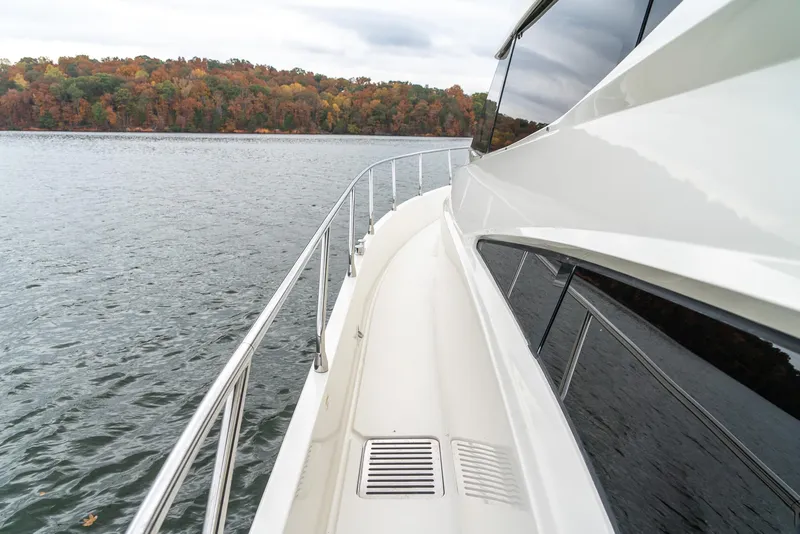 Slide: The Image of 2007 Marquis 59 Markham Edition yacht on a lake with autumn foliage. - 25