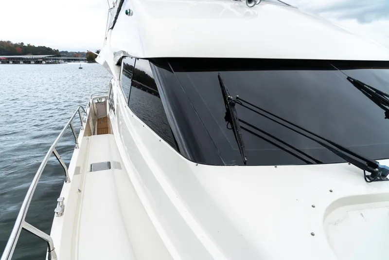 Slide: The Image of 2007 Marquis 59 Markham Edition yacht on calm water, side view. - 29