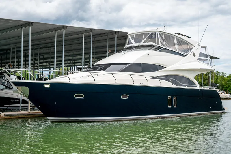 Slide: The Image of Luxury 2007 Marquis 59 Markham Edition yacht docked in marina. - 3