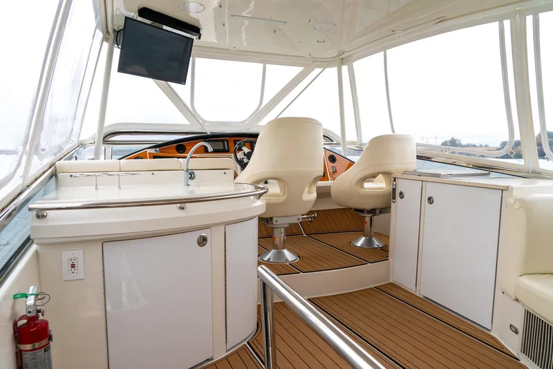 Slide: The Image of Luxurious interior of 2007 Marquis 59 Markham Edition yacht with helm and seating area. - 31