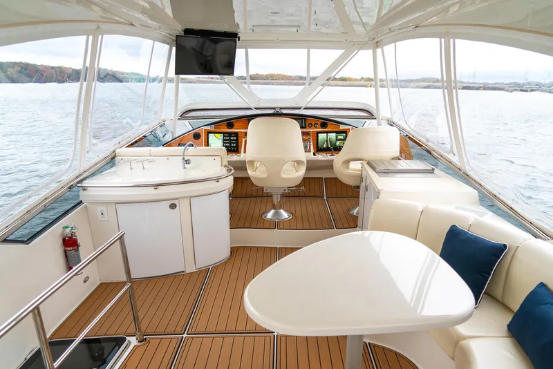 Slide: The Image of Luxurious 2007 Marquis 59 Markham Edition yacht interior with elegant seating and navigation area. - 33