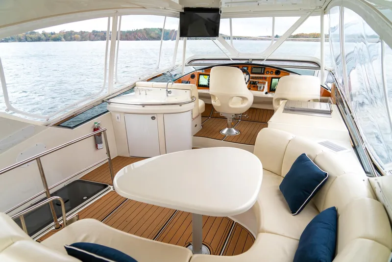 Slide: The Image of Luxurious 2007 Marquis 59 Markham Edition yacht interior with elegant seating and navigation area. - 34
