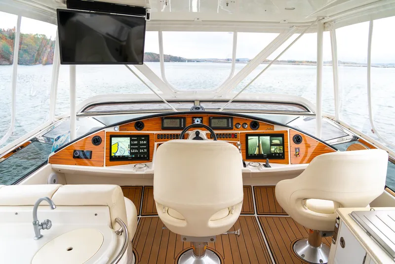 Slide: The Image of Luxurious 2007 Marquis 59 Markham Edition yacht interior with modern navigation equipment. - 35