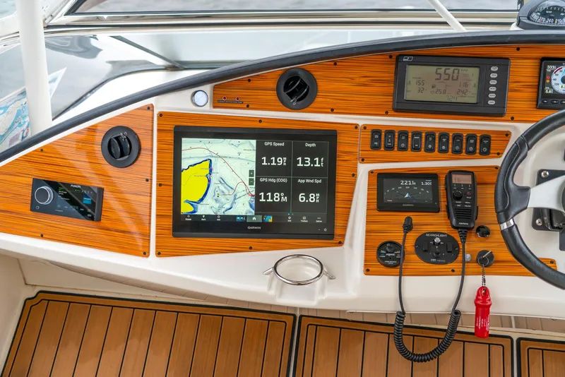 Slide: The Image of 2007 Marquis 59 Markham Edition yacht dashboard with navigation and control systems. - 37