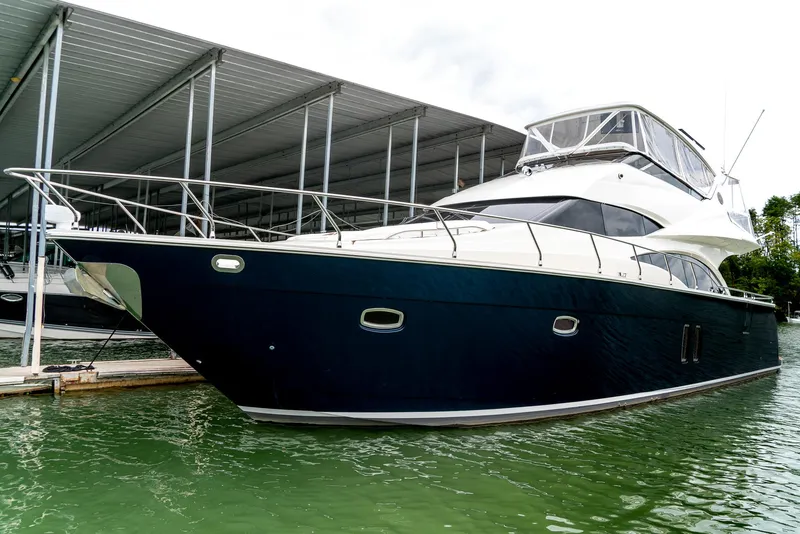 Slide: The Image of 2007 Marquis 59 Markham Edition yacht docked in marina. - 4
