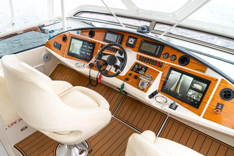 Slide: The Image of Luxurious 2007 Marquis 59 Markham Edition yacht cockpit with advanced navigation systems. - 40