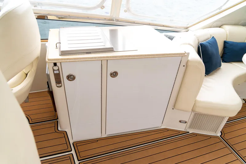 Slide: The Image of Luxurious 2007 Marquis 59 yacht interior with sleek cabinetry and plush seating. - 44
