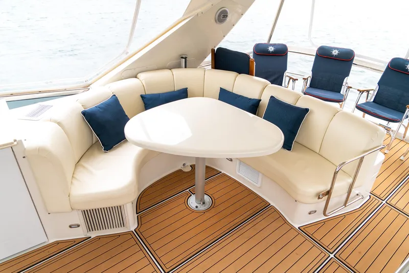 Slide: The Image of Luxurious seating area on 2007 Marquis 59 Markham Edition yacht with elegant wood flooring. - 47