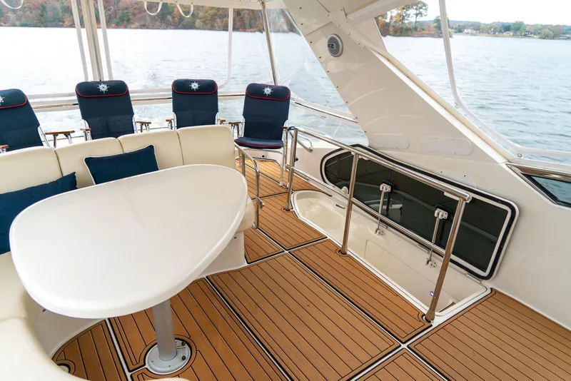 Slide: The Image of Luxurious 2007 Marquis 59 Markham Edition yacht interior with elegant seating and table. - 49