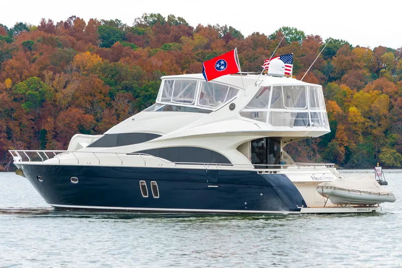 Slide: The Image of Luxury 2007 Marquis 59 Markham Edition yacht on a scenic lake with autumn foliage. - 6