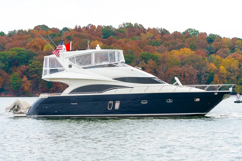 Slide: The Image of 2007 Marquis 59 Markham Edition yacht on a lake with autumn foliage background. - 8