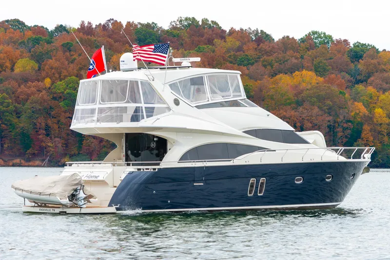 Slide: The Image of Luxury 2007 Marquis 59 Markham Edition yacht on a scenic lake with autumn foliage. - 9