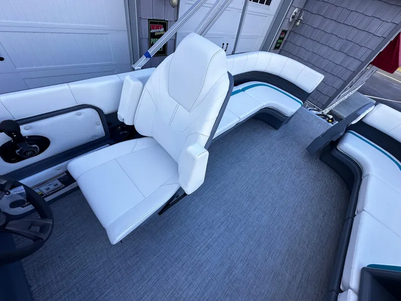 Slide: The Image of 2025 Avalon 2385 Aura Quad Lounge interior with white seating and modern design. - 13