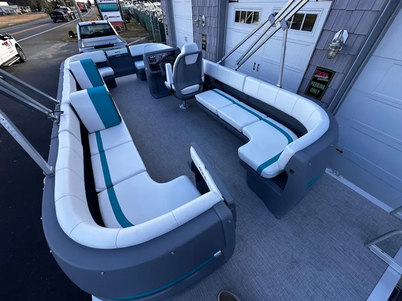 Slide: The Image of 2025 Avalon 2385 Aura Quad Lounge pontoon boat with spacious seating and modern design. - 7