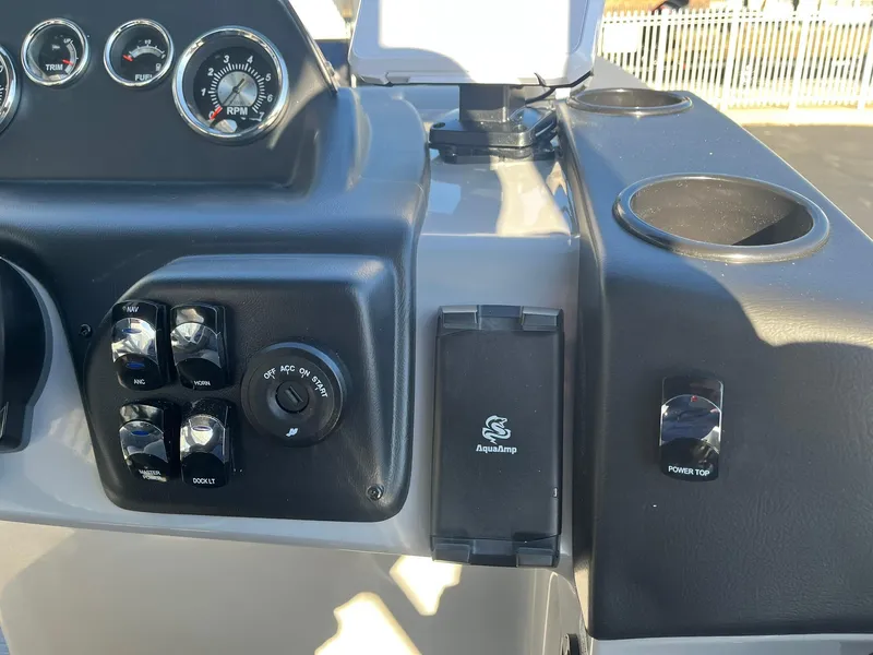 Slide: The Image of Control panel of 2025 Lowe LS 230 WT boat with gauges and switches. - 12