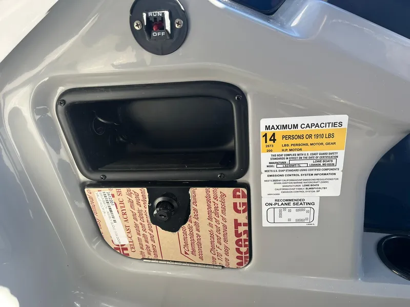Slide: The Image of Lowe LS 230 WT 2025 boat dashboard with capacity label and controls. - 14